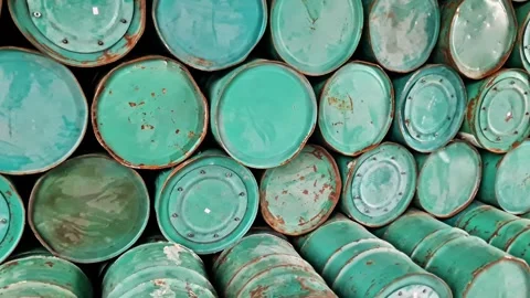 Industrial Symmetry High Stack of Weathered Green Metal Oil Drums Video stock 331269673