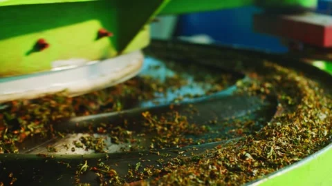 Industrial tea processing machine with rotating drum close-up Stock Footage 335863203