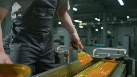 Industrial Technician Adding Yellow Ink to Offset Printing Press Machine Stock Footage 335483045