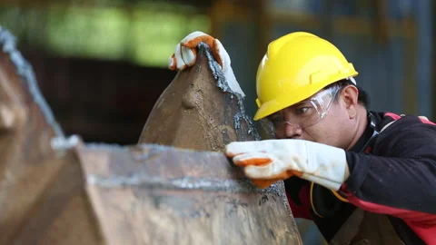 Industrial technician Check the work after cutting large pieces of steel. Stock Footage 336937025