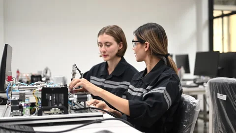 Industrial technicians working with machine maintenance Stock Footage 241521300