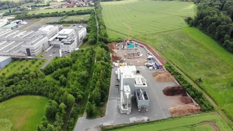 Industrial technology construction site with new power plant filmed from abov Stock Footage 154711515