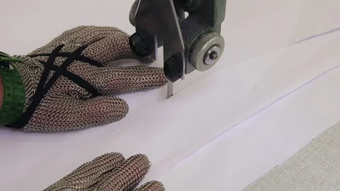 Industrial Textile Cutting Machine With Protective Glove Close Up Vídeos de archivo 328303211