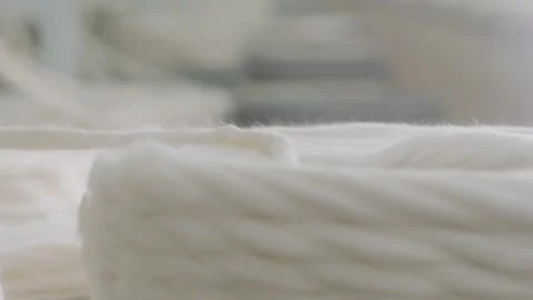 Industrial textile manufacturing, Coiling process of natural white cotton Stock Footage 332539742