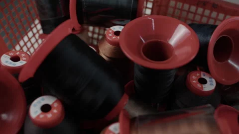 Industrial Thread Spools in Basket at Shoe Manufacturing Facility Close Up 库存影片 341668085