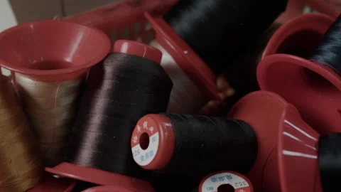 Industrial Thread Spools in Basket at Shoe Manufacturing Workshop Close Up 库存影片 341668528