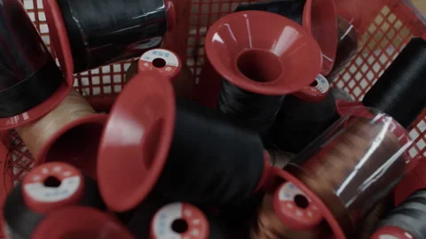 Industrial Thread Spools in Red Basket at Workshop Table for Shoe Manufacturing 库存影片 341668714