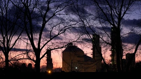 Industrial through Trees at Sunset Stock Footage 97369031