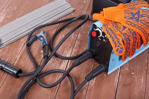 Industrial tool - Welding machine, electrode and working gloves Stock Photos