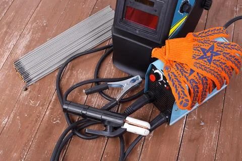 Industrial tool - Welding machine, electrode, mask and working gloves Stock Photos