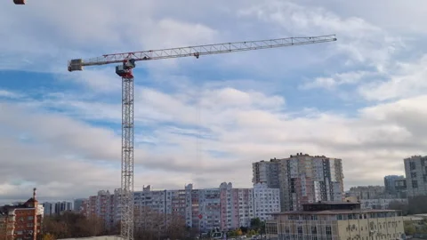 Industrial tower crane operating on a construction site Stock Footage 327158895