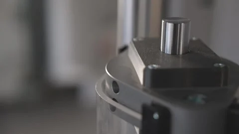 Industrial universal testing machine pressing metal cylinder Stock Footage 313526396