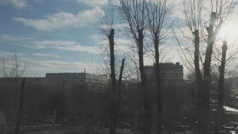 Industrial urban view from train window. Bridge over highway with car traffic at Stockbeeldmateriaal 134019655