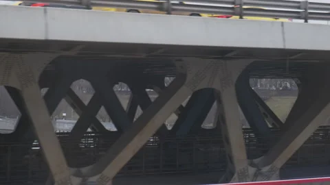 Industrial urban view from train window. Bridge with cat traffic over the river. Vídeos de archivo 134020534