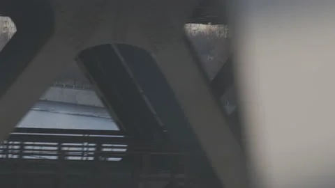 Industrial urban view from train window. Bridge over the river at sunset. Stock Footage 134133335
