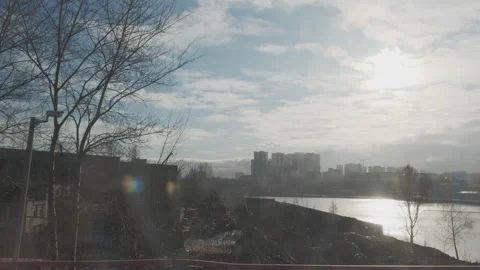 Industrial urban view from train window. Bridge over river and highway with car Stock Footage 134135265