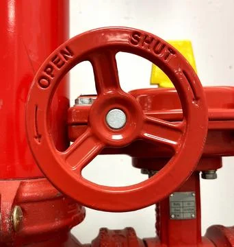 Industrial Valve with arrows and text. Red Tubes Stock Photos