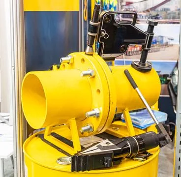 Industrial valve component with yellow flange, secured bolts, handle, clamp.. Stock Photos