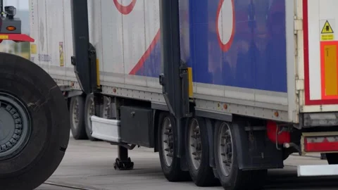 Industrial Vehicle Loads Container Onto Cargo Train Wagon at Freight Terminal Stock Footage 338371809