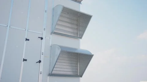 Industrial ventilation system with large metal air intake hoods on modern b.. Stock Footage 337389448