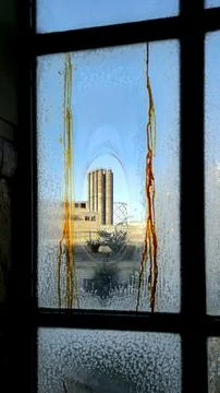 Industrial view through old window Stock Photos