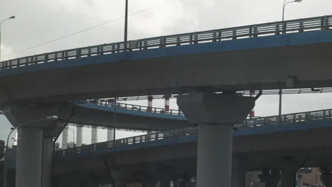 Industrial view from train window. Pipes of the thermal power plant. Pollution Stock-Footage 148243908
