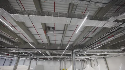 Industrial warehouse interior with suspended ceiling systems, ventilation d.. Stock Footage 337389503