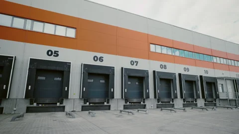 Industrial Warehouse Loading Bays. Section of an industrial warehouse Stock Footage 260693276