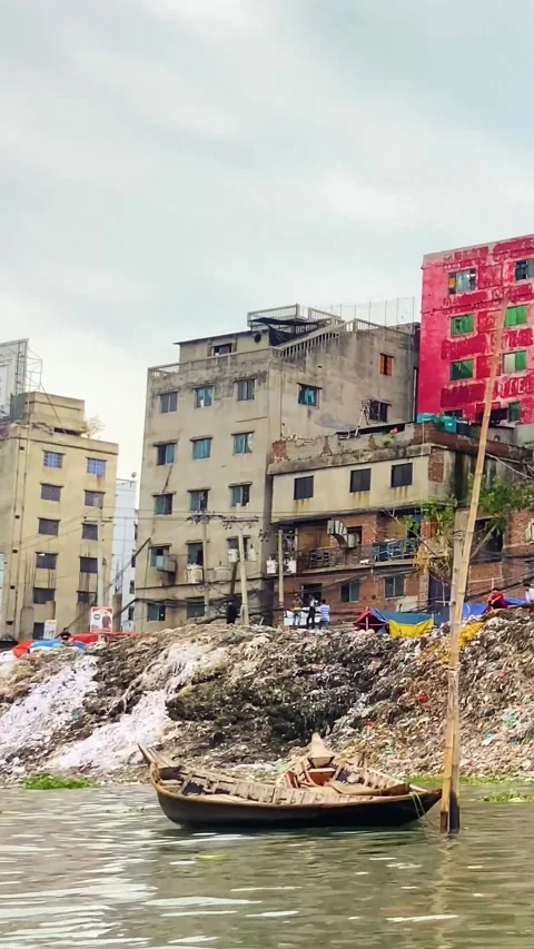 Industrial waste garbage and river pollution affecting urban life at sadarghat Stock Footage 333001815