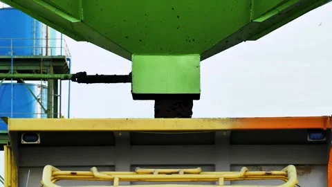 Industrial waste management, loading sludge into truck from green hopper Stock Footage 338364893