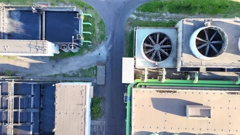 Industrial water purification facility showcasing multiple treatment tanks and Stockbeeldmateriaal 341470109