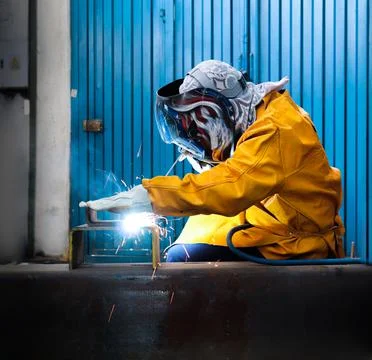 Industrial welder in mechanical workshop Stock Photos