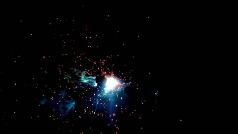 Industrial welding process creates sparks and molten metal droplets illumin.. Stock-Footage 347288106