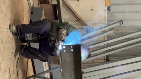 Industrial Welding Scene with Worker Fabricating Large Metal Structure Stock Footage 313921926