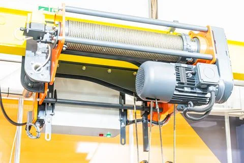 Industrial winch system close-up, mechanical components, coiled cable, motor, Stock Photos