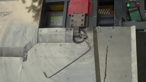 Industrial wire bending machine operating in metal fabrication workshop Stock Footage 341104122