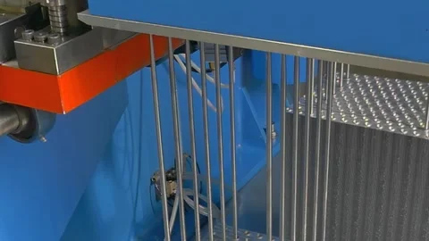 Industrial Wire Cutting Machine Operating With Rhythmic Precision at Noon Stock Footage 340486389