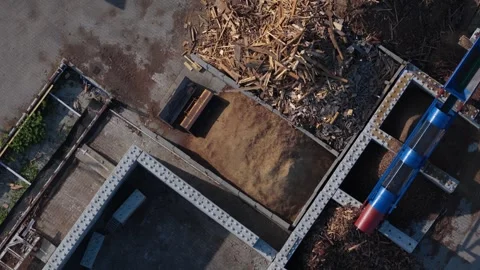 Industrial wood chipper processing lumber at a sawmill for renewable energy 스톡 동영상 348632168