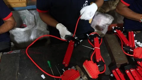 Industrial Worker Assembling Red Electrical Components with Cables Stock Footage 318946564