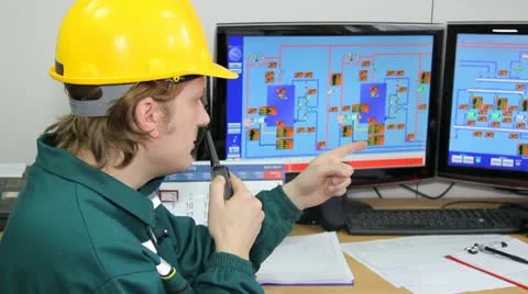 Industrial worker in control room Stock Footage 10895505