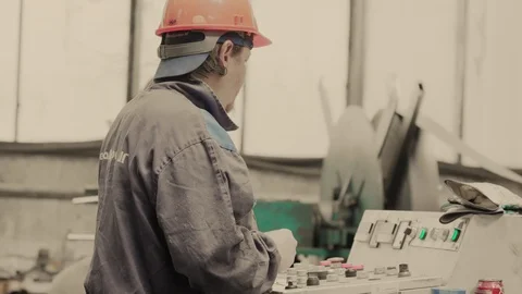 Industrial worker in gloves operating machine on control panel in metal industry Stock Footage 121192438