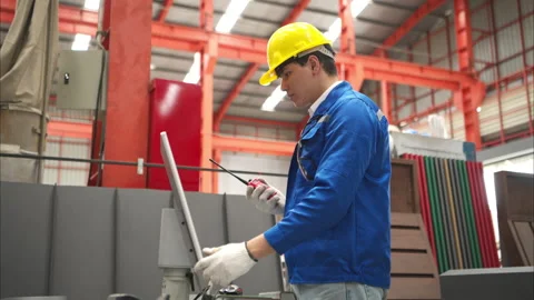 Industrial worker inspecting inside a large metal tube Stock Footage 317902711