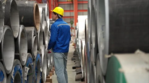 Industrial worker inspecting inside a large metal tube Stock Footage 317903034