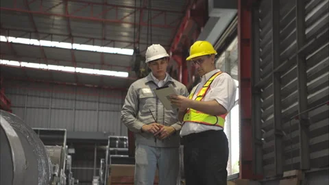 Industrial worker inspecting inside a large metal tube Video stock 317905178
