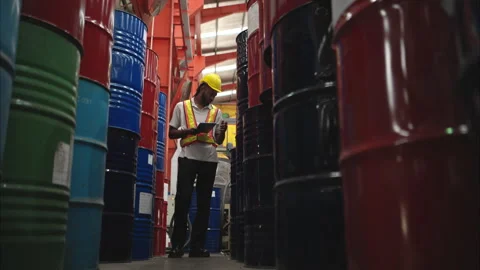 Industrial worker inspecting inside a large metal tube Stock Footage 317905195