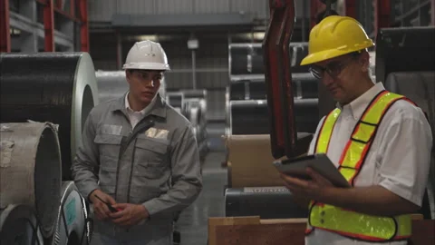Industrial worker inspecting inside a large metal tube Stock Footage 317905428