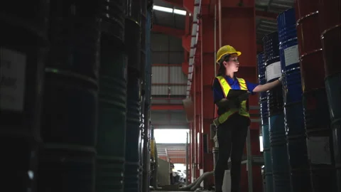 Industrial worker inspecting inside a large metal tube Stock Footage 317905663