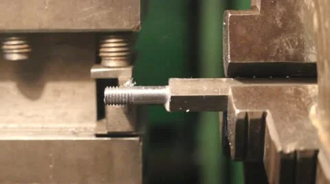 Industrial worker makes a stud using a lathe machine Stock Footage 12119218