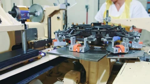 Industrial worker operating complex machinery in large factory workshop Stock Footage 340604230