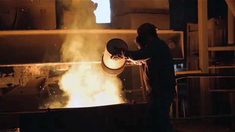Industrial Worker Pouring Additives From Bucket In Steel Mill Foundry - 4K Видео 344426469